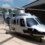 Custom helicopter paint work in silver and dark blue