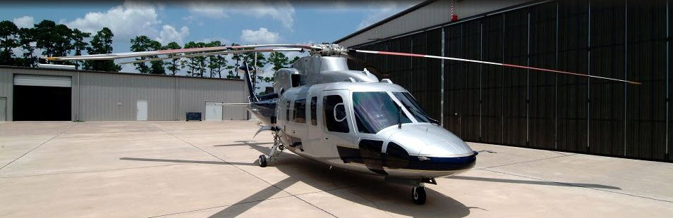Custom helicopter paint work in silver and dark blue