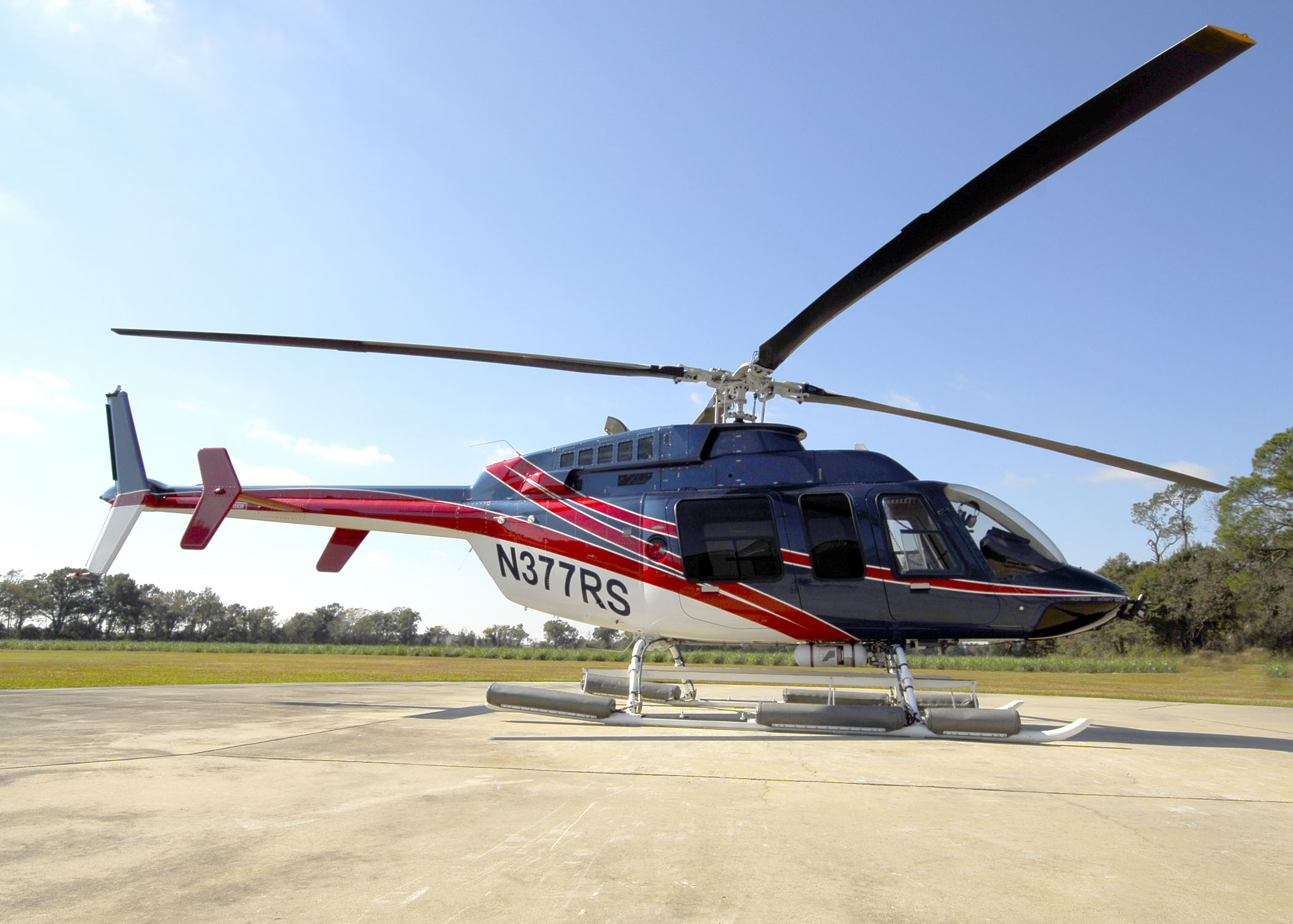 Bell 407 helicopter on helipad at Arrow Aviation